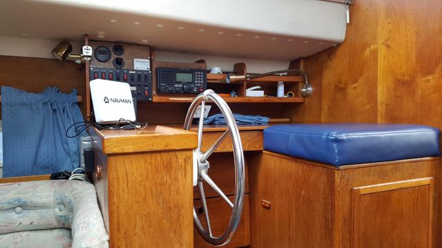 Helm position with adjacent nav table instrumentation.