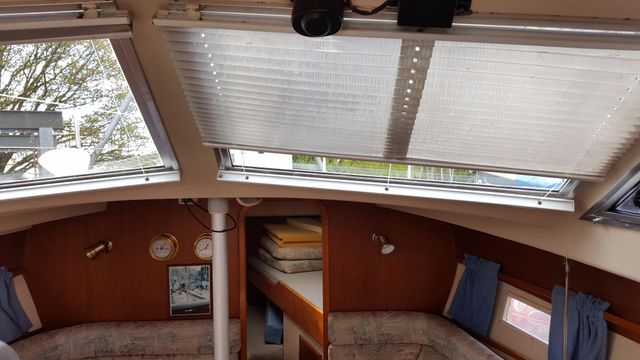 Windows have blinds and curtains.