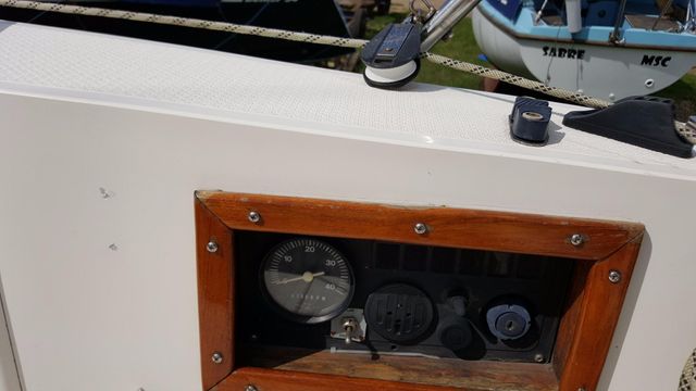 New engine controls in coaming cave locker.