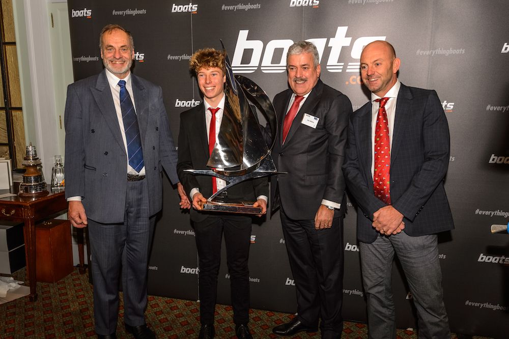 Elliott Kuzyk receives the 2016 boats.com YJA Young Sailor of the Year award from Ian Walker.