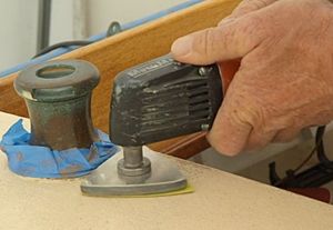 Sanding to prepare for painting decks.