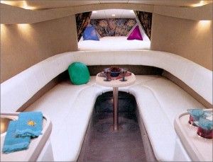 A horseshoe-shape lounge upholstered in UltraLeather HP and a two-person V-berth make the cabin inviting.