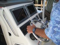A comfortable centre console area houses electronics and access to the cabin.