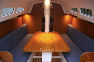 The interior is simple and linear. The saloon table can be removed and kept ashore for racing.