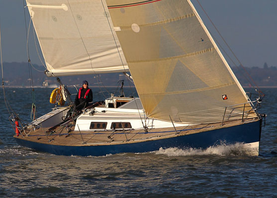 A photo of a sailboat with teak decks. 