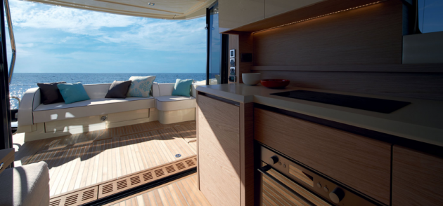 The aft galley makes entertaining guests in the aft cockpit a breeze. Note how the aft sliding doors completely fold open to create an extension of the main salon.