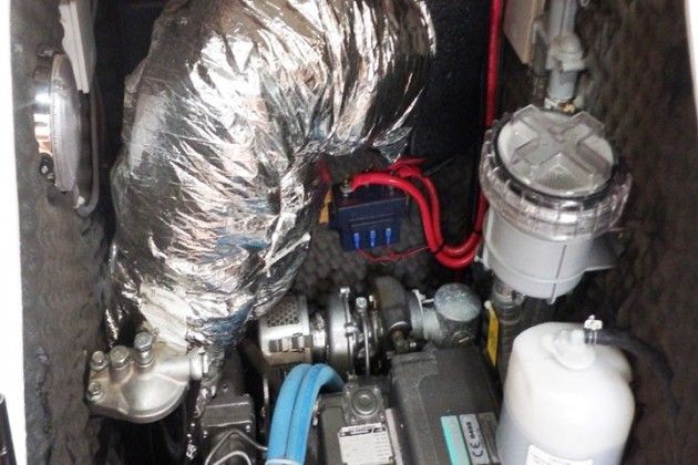 Here's a recipe for trouble: The insulation is in contact with the turbo below it, and the battery isolator is mounted too close to the turbo and exhaust system.