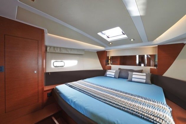 The V-berth master stateroom features an island berth than can be lengthened to full six feet, six inches in length with the addition of a filler cushion.