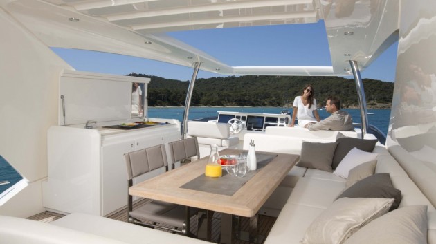 The flybridge on the Prestige 750 provides plenty of entertaining and relaxation areas for a a large group of guests. 