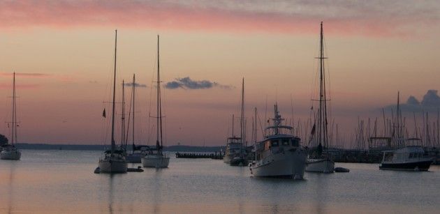 Boats sit quietly at both morning balls, and on their own anchors in Annapolis Harbor, MD.