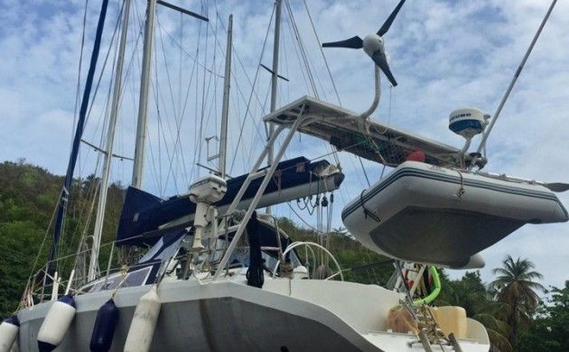 The solar panel array and wind turbine on this cruising sailboat are self-limiting in amperage output.