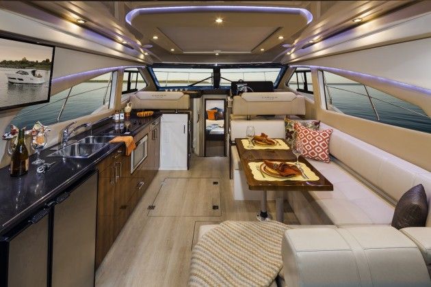 Carver has always had a knack for making the most out of every inch of space on its boats, and that skill is apparent in the roomy main salon. Note the overhead opening sunroof, covered by a sunshade in the photo. Photo courtesy of Carver
