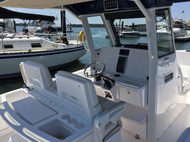 There's plenty of room for all sorts of electronics goodies in the Everglades 295cc's dash. Note the rigging station situated behind the console seating. Also note the blind spot created by the support pillars in the windshield. Photo by Gary Reich