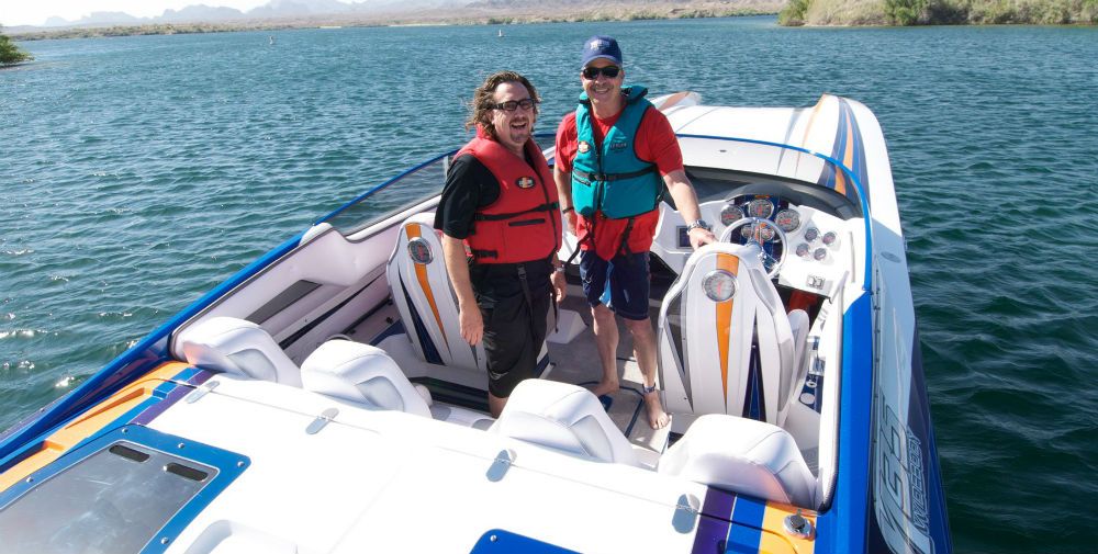 Brad Schoenwald (left) , a highly experienced instructor at Tres Maartin's Performance Bot School, takes to the water with a student in a catamaran.