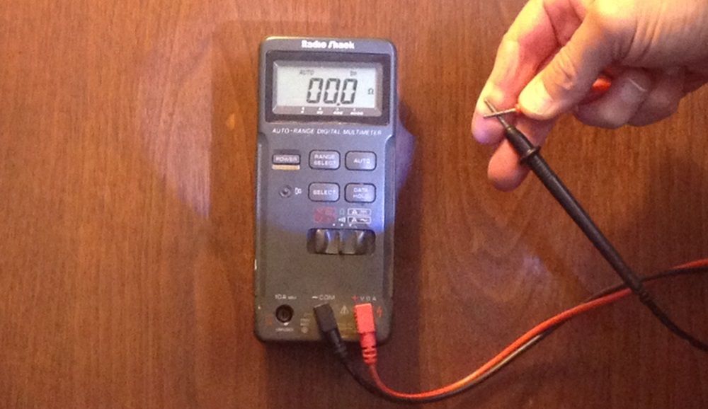 Fig. 5 - To check your multimeter’s internal battery, set it to the ohms reading and touch the two probes together. You should get a zero reading, indicating no resistance and a good battery.