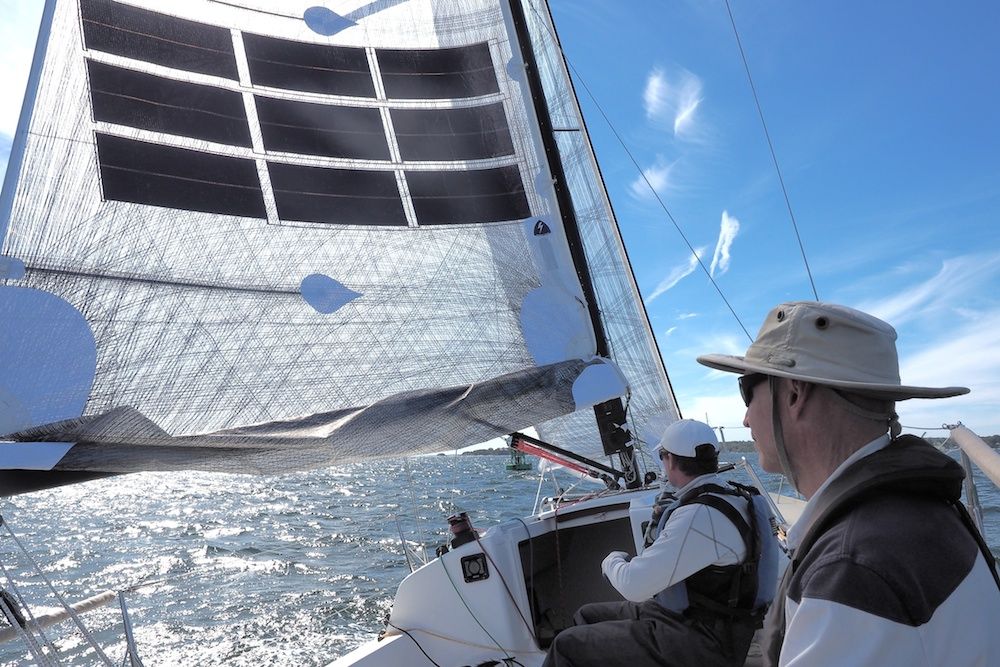 J/88-Oceanvolt-reaching-under-reefed-mainsail.