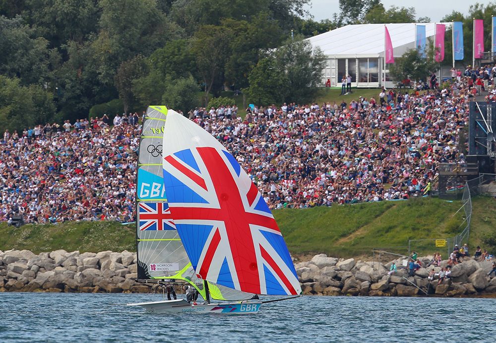This photo captures the medal race sailing at the 2012 Olympic Games, as a 49er races close to the crowds. Photo OnEdition.