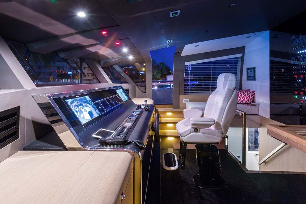 The state-of-the art helm has excellent views forward and to the sides, and sits just ahead of the interior skylounge, where guests can either visit the open aft deck with its outdoor galley or enjoy the air-conditioned comfort inside. The state-of-the art helm has excellent views forward and to the sides, and sits just ahead of the interior skylounge, where guests can either visit the open aft deck with its outdoor galley or enjoy the air-conditioned comfort inside.