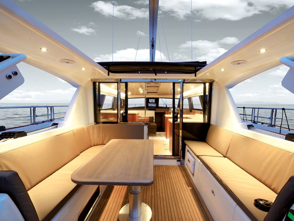 Two composite prongs extend from the cabintop all the way aft to the helms. Their butt ends terminate in a grabrail, providing an extra handhold for the driver. The void between the two prongs serves as a large open sunroof over the cockpit, which can be covered with a sun shade that slides fore and aft manually.