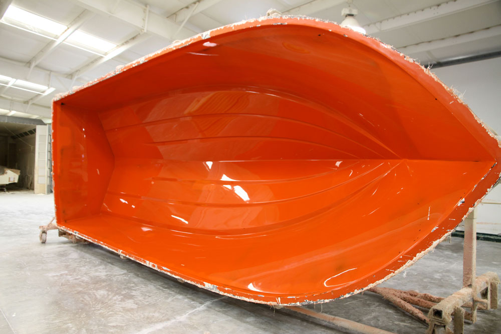 This female hull mold, from Parker Boats, is ready to be sprayed with gel coat and then laid up with fiberglass. A mold like this can be used to produce thousands of boat hulls.