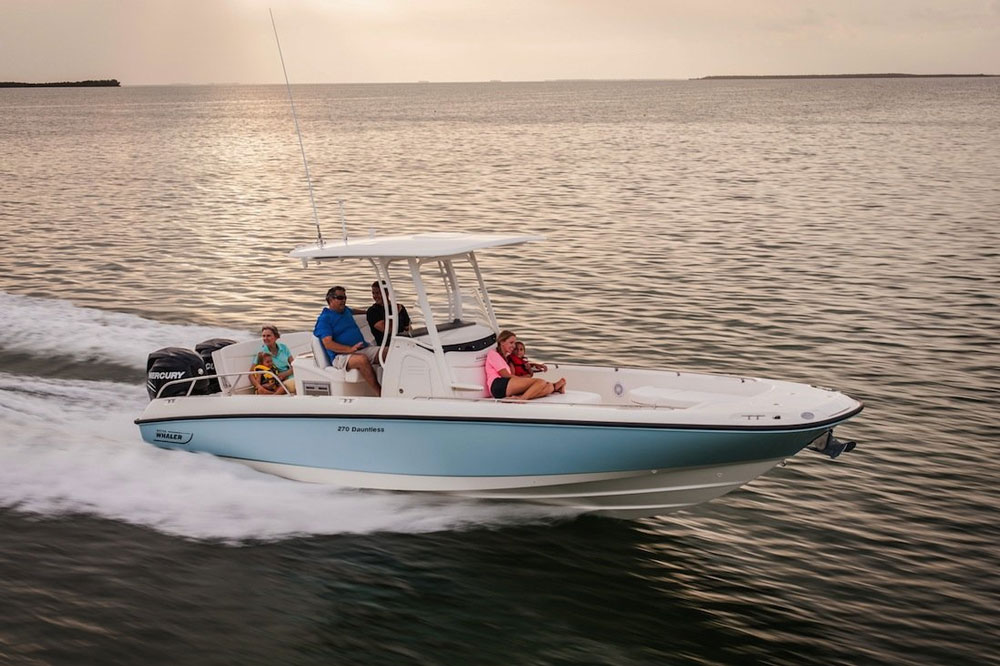 As you can see in this photo of a Boston Whaler 270 Dauntless, a modern planning powerboat rises up out of the water to a large degree, after exceeding displacement speeds.