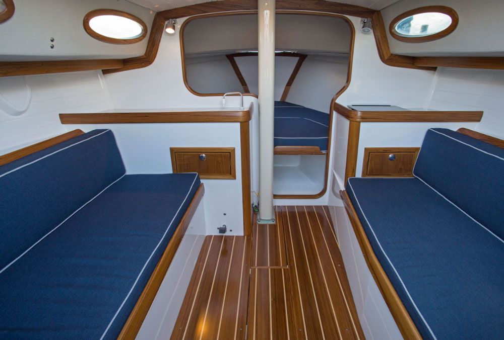 Two settees along either side of the hull could accommodate kids or short sailors overnight but packing in this many bodies would negate the civilized sailing this vessel is shooting for.