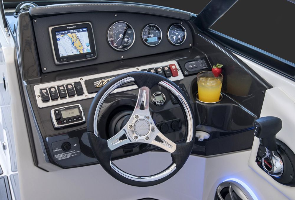The helm is a rewarding place to be. It’s laid out simply, with a tilt column, a stereo control head and depthfinder, a row of switchgear, then the vital analog gauges and space for an optional GPS chartplotter.