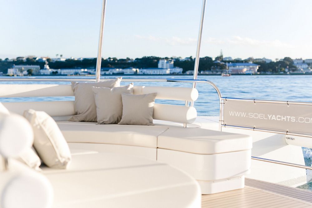 Hull number one is decked-out with plush seating on the perimeter and barstools around a centerline U-shaped countertop/bar that’s just aft of the helm (Another semi-circle lounge is just aft of that).