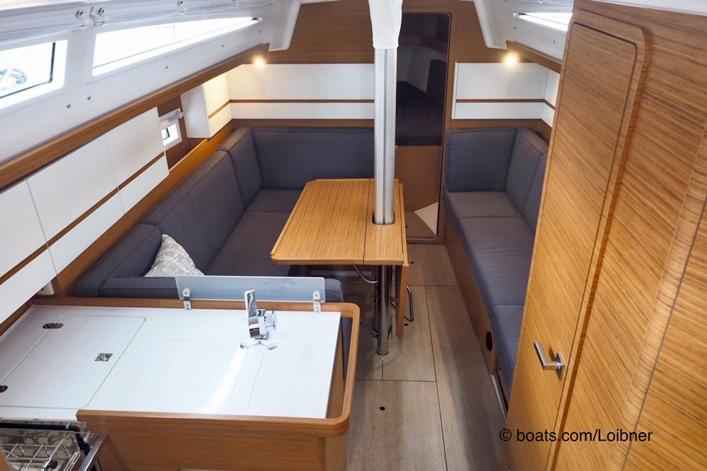 The keel-stepped mast required a creative solution with a saloon table that has two fold-down leaves, but it also provides a practical place to hold on when moving about this part of the cabin when at sea.