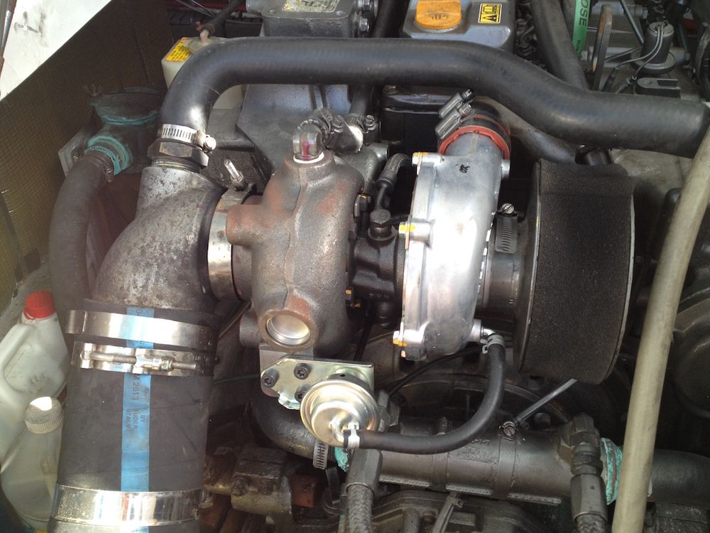 A new turbocharger has been mounted on this Yanmar diesel. The air filter fitting to the right can be removed to inspect the intake side of the turbo. Doug Logan photo.