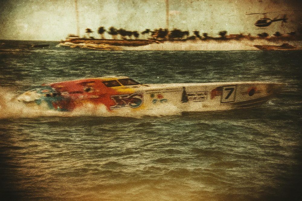 The iconic 47' Fountain 'INXS' powerboat thunders across the waves, its sleek V-bottom hull and triple engines embodying offshore racing dominance in events like the Key West World Championships. Image by VÉHICULE