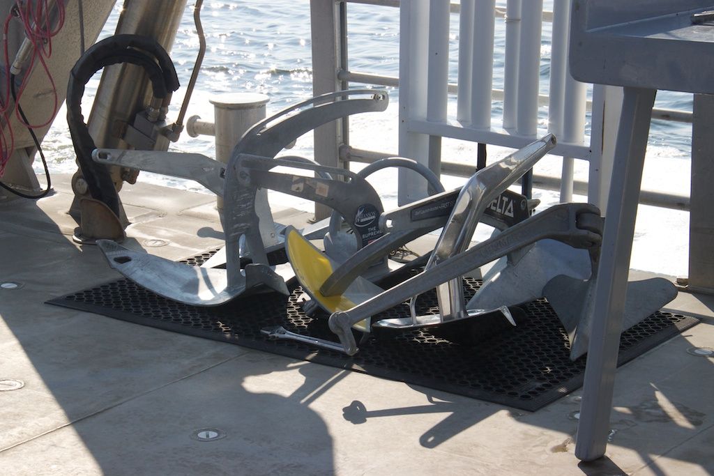 A variety of new-fangled anchors sit lined up on the aft deck of the research vessel Rachel Carson during Fortress Anchors' 2014 anchor testing in Solomons, MD, on Chesapeake Bay.