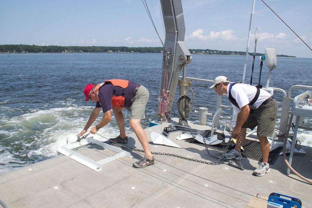 Fortress Anchor representatives get ready to put a 44-pound Delta anchor through its paces. Note the blue tension meter on deck to the right.