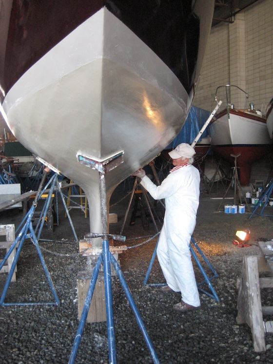 bottom-job-1934 Peter sands the soapy port side of our International One-Design.