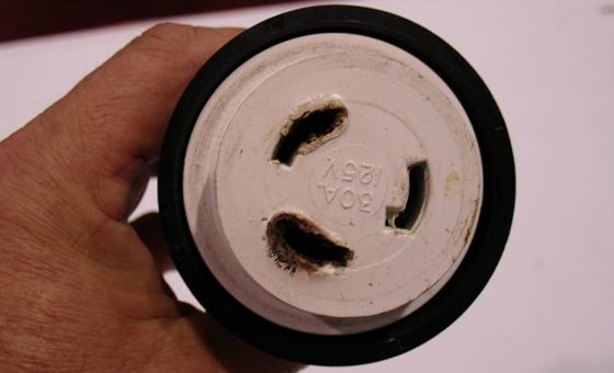 melted-shore-cord-001 The plug is almost new, but loose or corroded parts inside the shore-power fixture on the boat may have caused this melting.