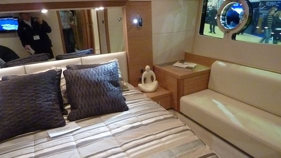 portofino-48-9215 The master stateroom, with seating and a large window outboard on either side.
