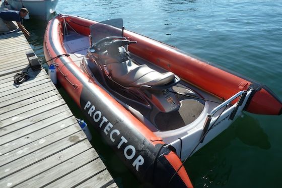 protector-20-16306 The Protector Jet fits a Yamaha PWC in the center section molded into its fiberglass hull. The transom looks remarkably naked without an outboard engine.