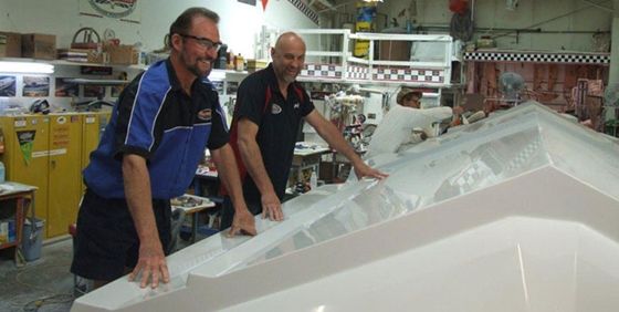 trulio-sunsation-tooling Wayne (in foreground) and Joe Schaldenbrand with the hull plug for their new 34-foot center-console.