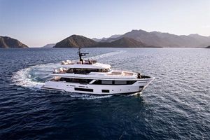Custom Line Navetta 30 Luxurious 2023 Custom Line Navetta 30 yacht cruising in scenic ocean waters.