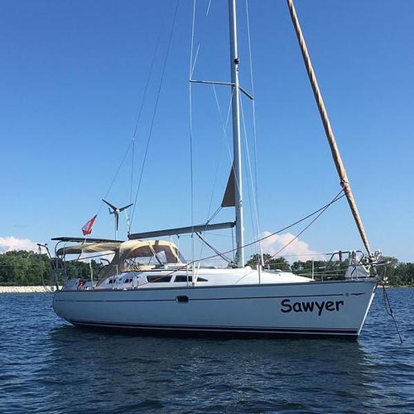 Jeanneau SO 37 2004 Jeanneau SO 37 sailboat named Sawyer on calm water.