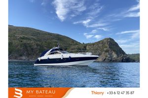 Princess V40 Luxury 1997 Princess V40 yacht on scenic coastal waters.