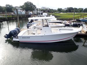 Regulator 23 Center Console 2020 Regulator 23 Center Console boat docked in a marina.