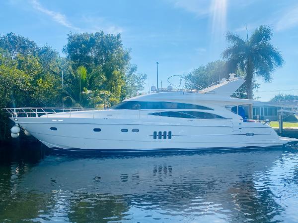 Viking Sport Cruisers 70 Motor Yacht 2006 Viking Sport Cruisers 70 Motor Yacht docked by lush greenery.