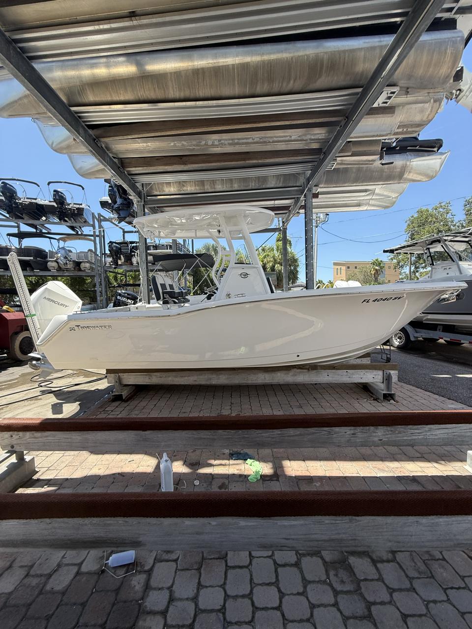 Tidewater 232 CC Adventure 2021 Tidewater 232 CC Adventure boat on display in a marina setting.