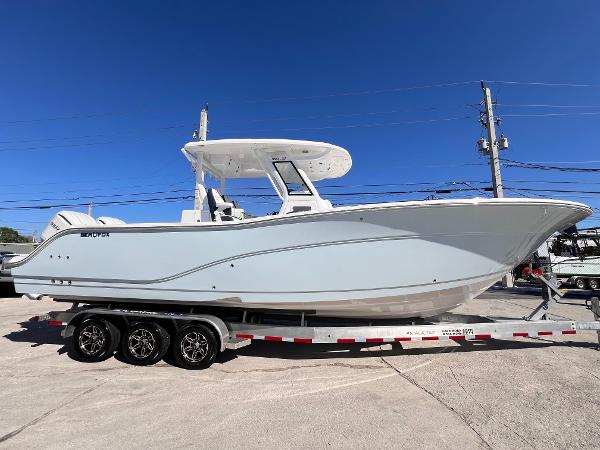 Sea Fox 328 Commander 2025 Sea Fox 328 Commander boat on a trailer under clear blue sky.