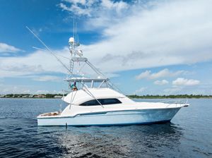Bertram 570 2004 Bertram 570 yacht on calm water under a clear blue sky.