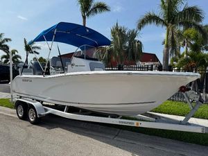 Sea Fox 206 Commander 2019 Sea Fox 206 Commander boat on trailer, blue canopy, palm trees in background.