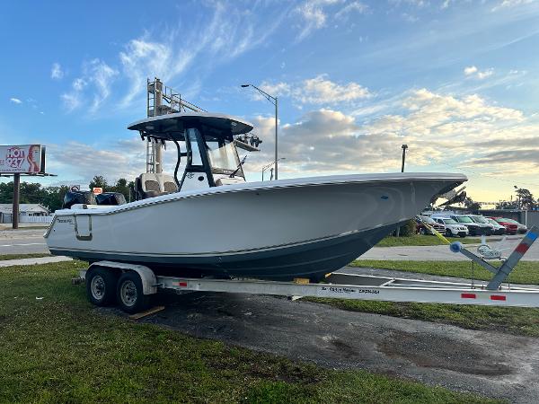 Tidewater 256 LXF 2024 Tidewater 256 LXF boat on a trailer under a blue sky.