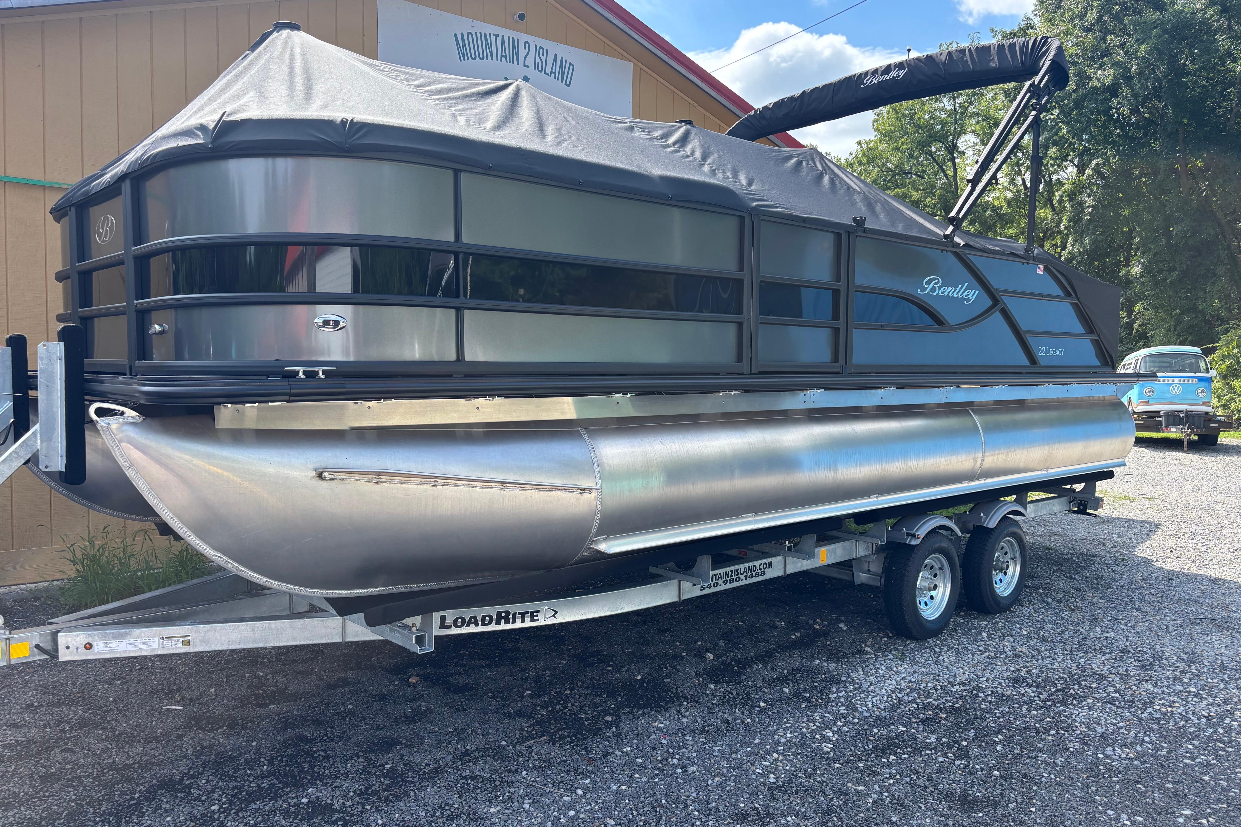 Bentley Pontoons Legecy 220 Swingback Dual Captain 2026 Bentley Pontoons Legacy 220 Swingback Dual Captain on trailer, outdoor setting.