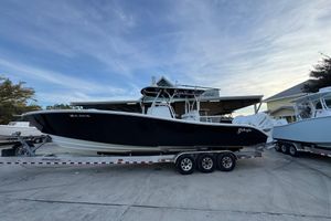 Yellowfin 34 Offshore 2019 Yellowfin 34 Offshore boat on trailer, parked outdoors under a clear sky.